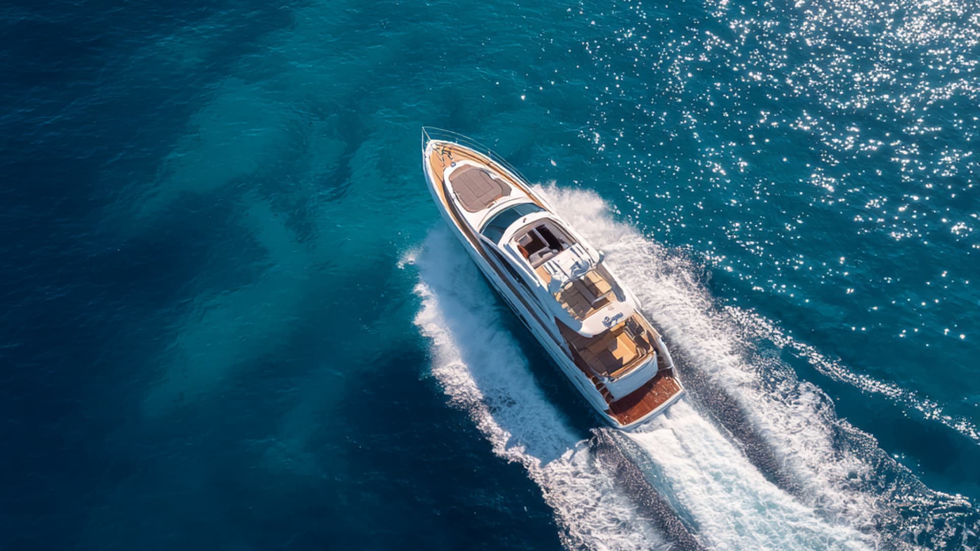 Yacht sailing past Sardinian coastline