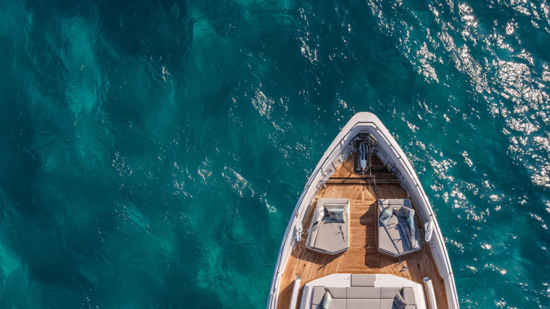 Catamaran anchored in turquoise bay near La Maddalena, Sardinia